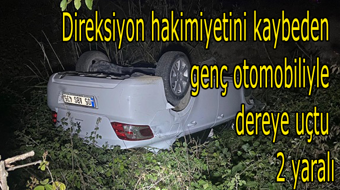 Direksiyon hakimiyetini kaybeden genç otomobiliyle dereye uçtu 2 yaralı